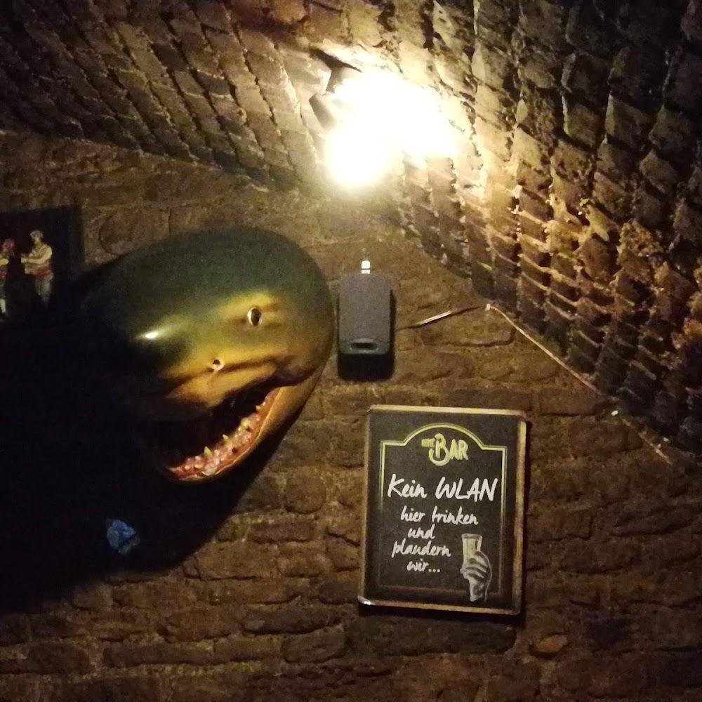 Shark head on brick wall,